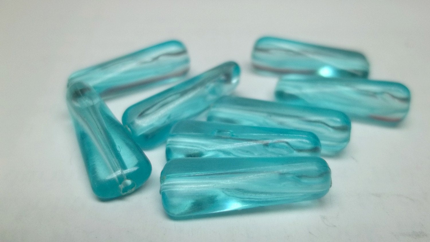Ice blue 12x7 vintage oblong plastic bead