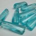Ice blue 12x7 vintage oblong plastic bead