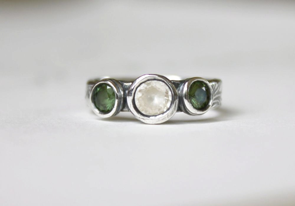 ethical three sapphire wedding or engagement band ring . faceted green and white fair trade sapphires . recycled silver by peaces of indigo