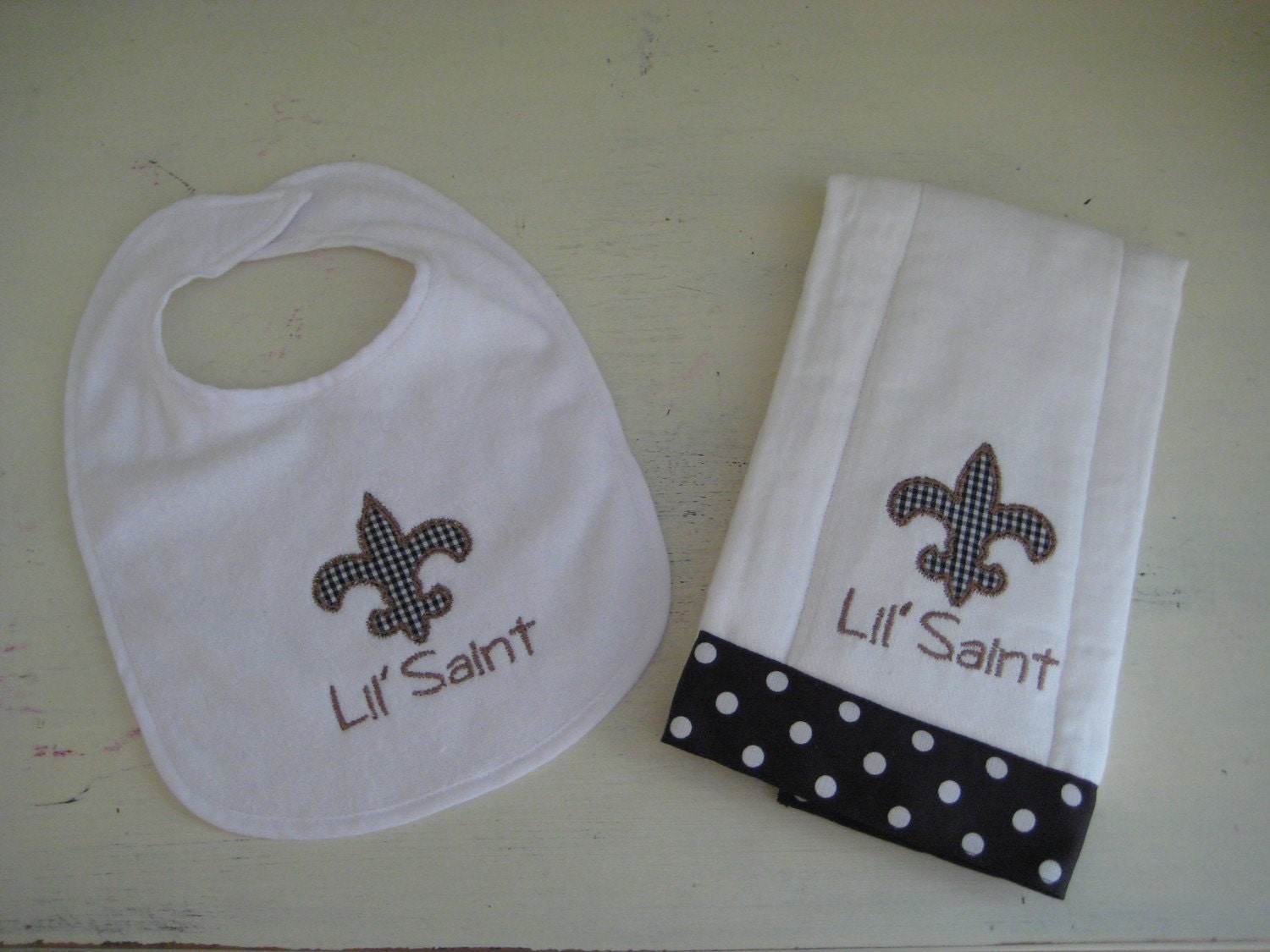Appliqued Lil Saint Fleur De Lis Bib and Burp Cloth Set with Ribbon Trim, Who Dat