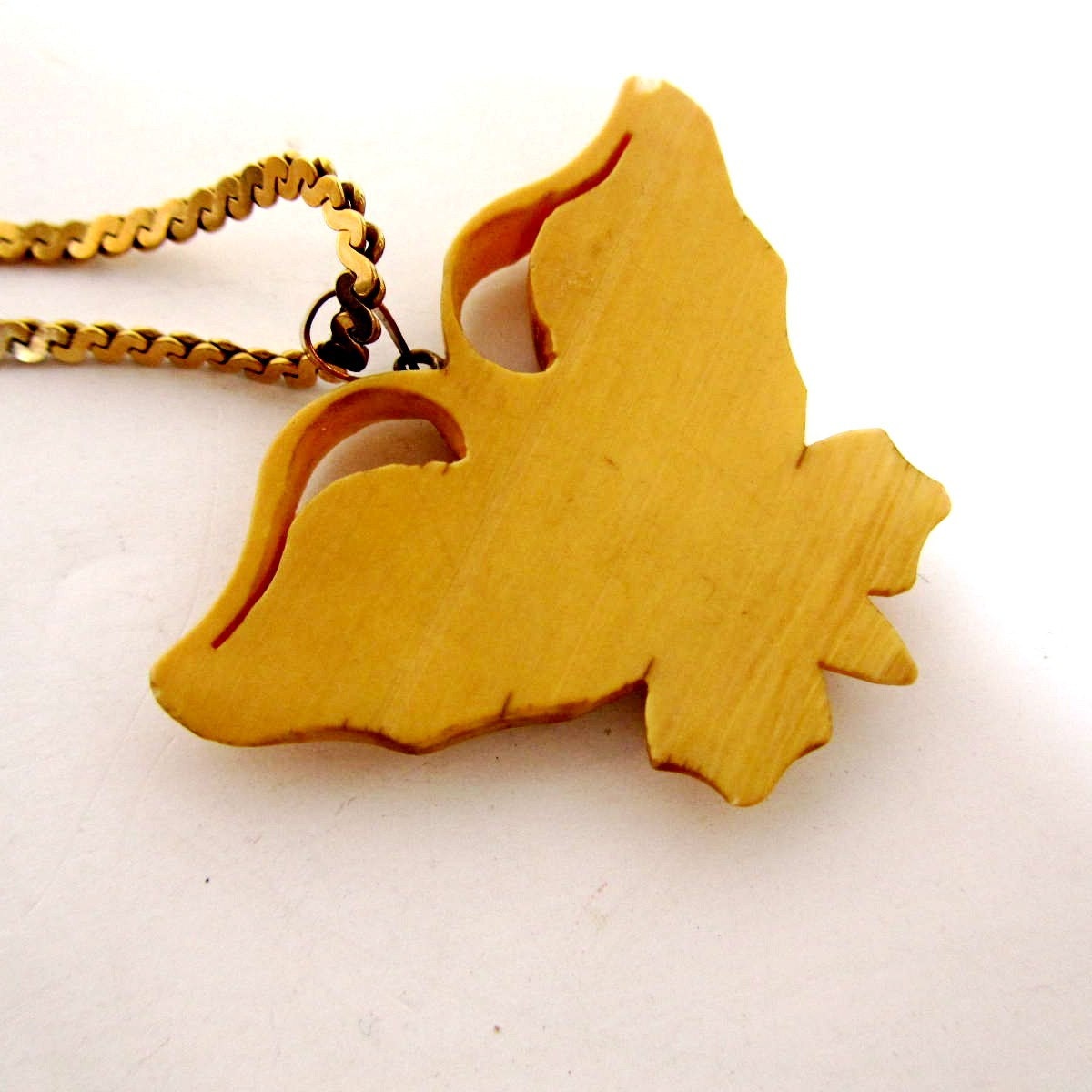 Vintage ivory celluloid butterfly pendant