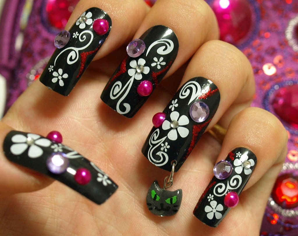 Japanese nail art, black long nails with a dangling kitty