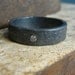 Darkened sterling silver men's ring band with flush set diamond, blackened sterling silver