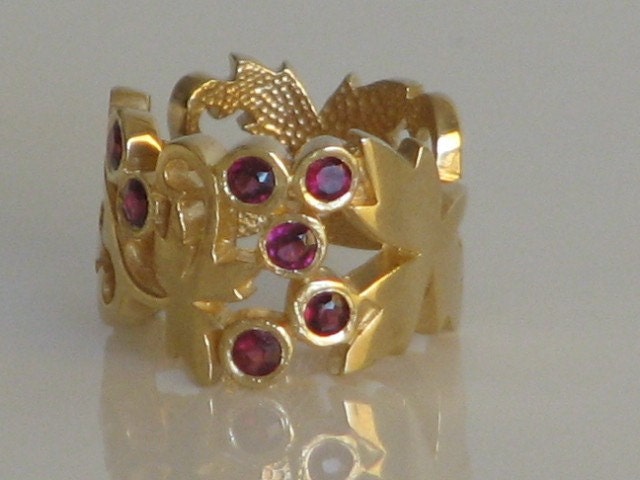 Sterling Silver Ring , 14K Gold plated with lovely garnet stones