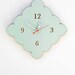 tiny scallop clock in poppy red