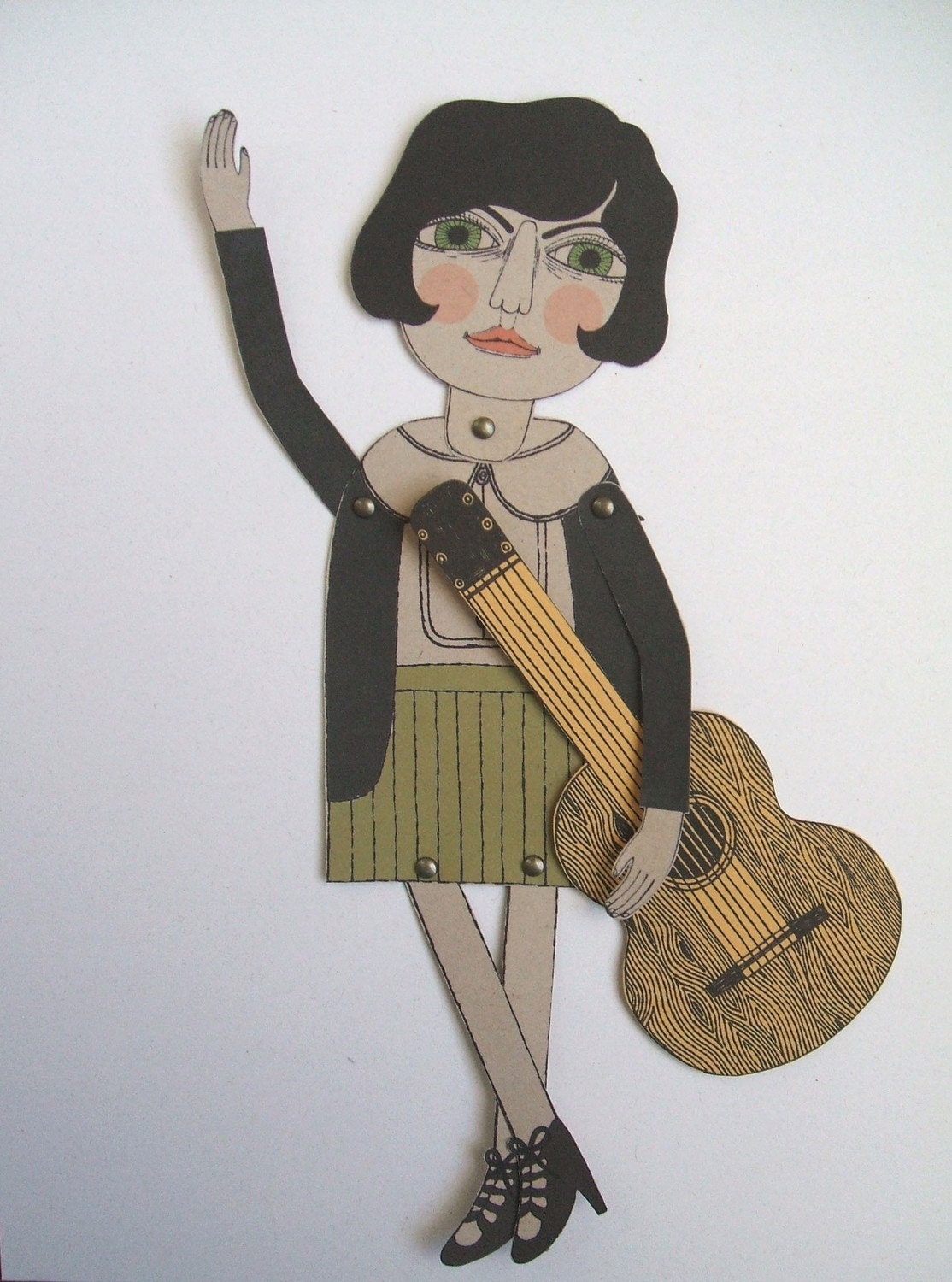 Josephine joue de la guitare