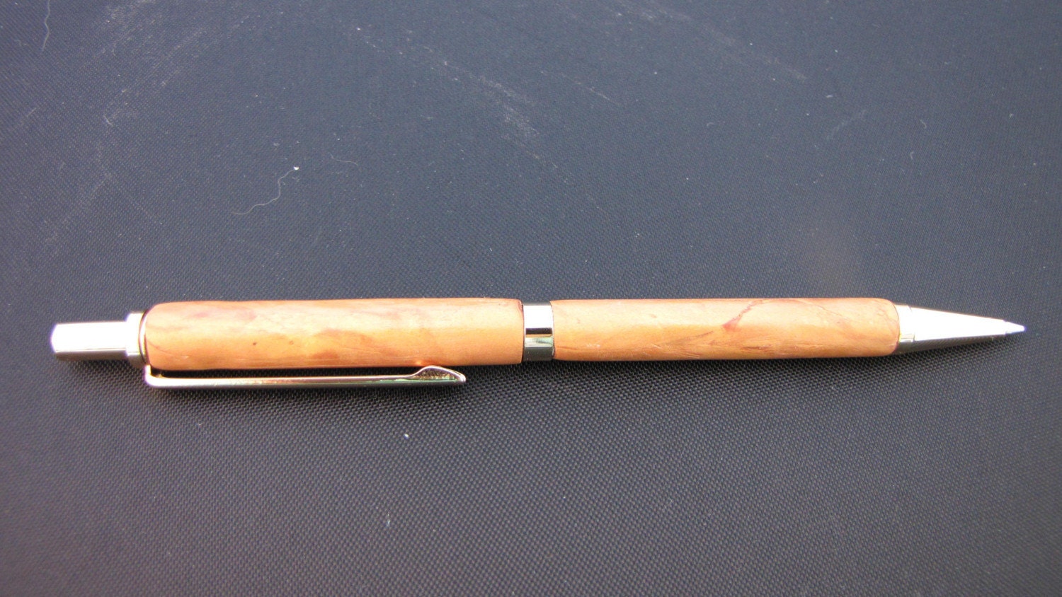 Twist ballpoint pen in gold toned polymer clay with brass fittings