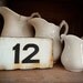 vintage enamel house number from Europe, number 12 black on white with great patina