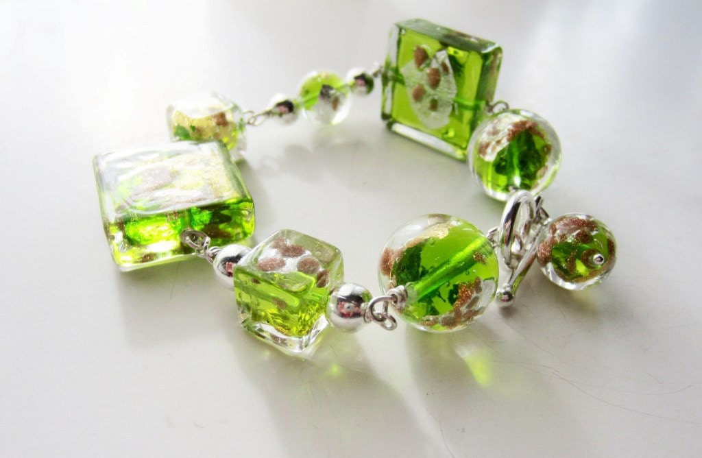 Green glass bracelet.  Venetian glass lampwork.  Wire wrapped sterling silver.
