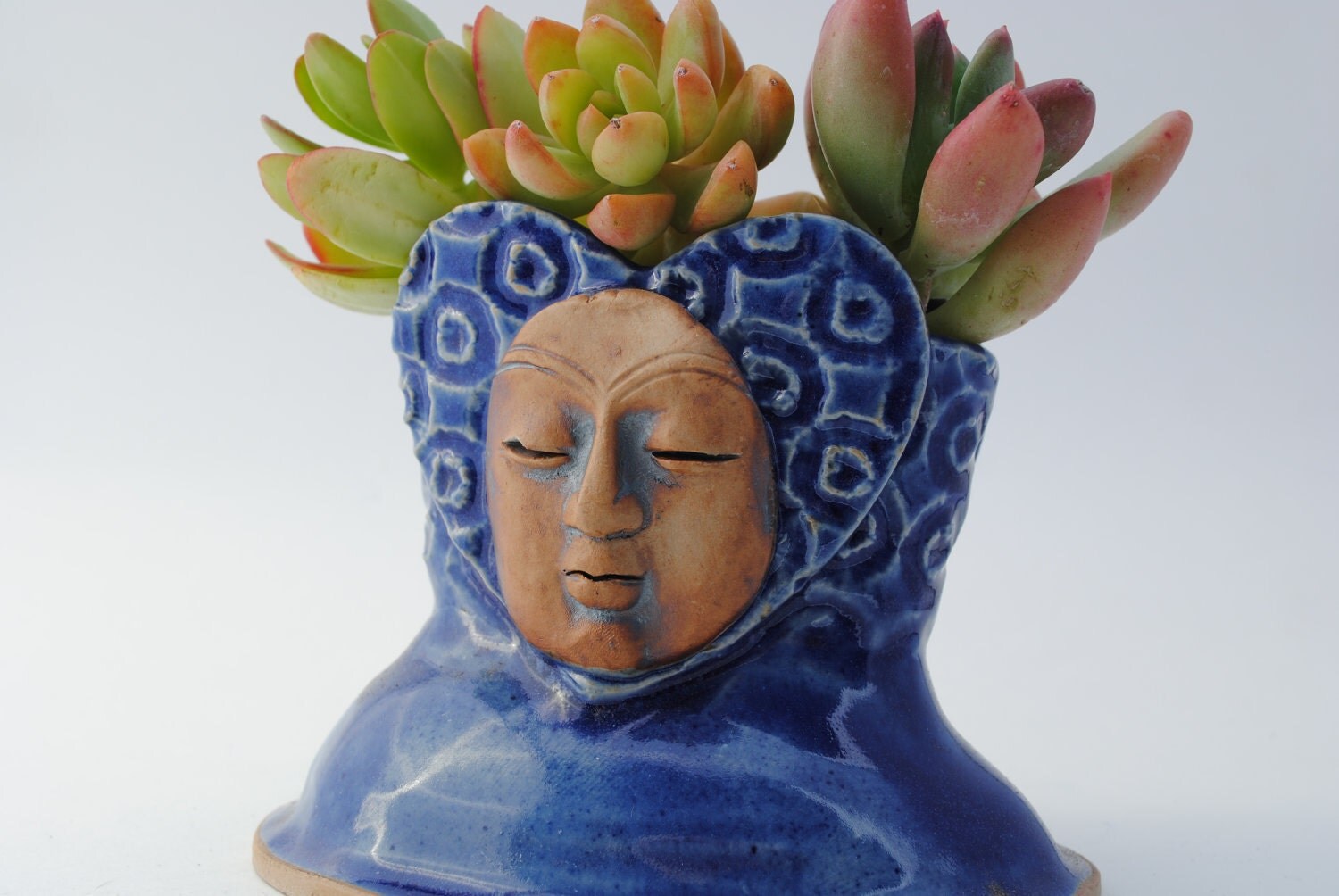 ceramic face sculpture