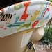 EVENFLO EXPRESSIONS High Chair Cover - Alphabet Soup