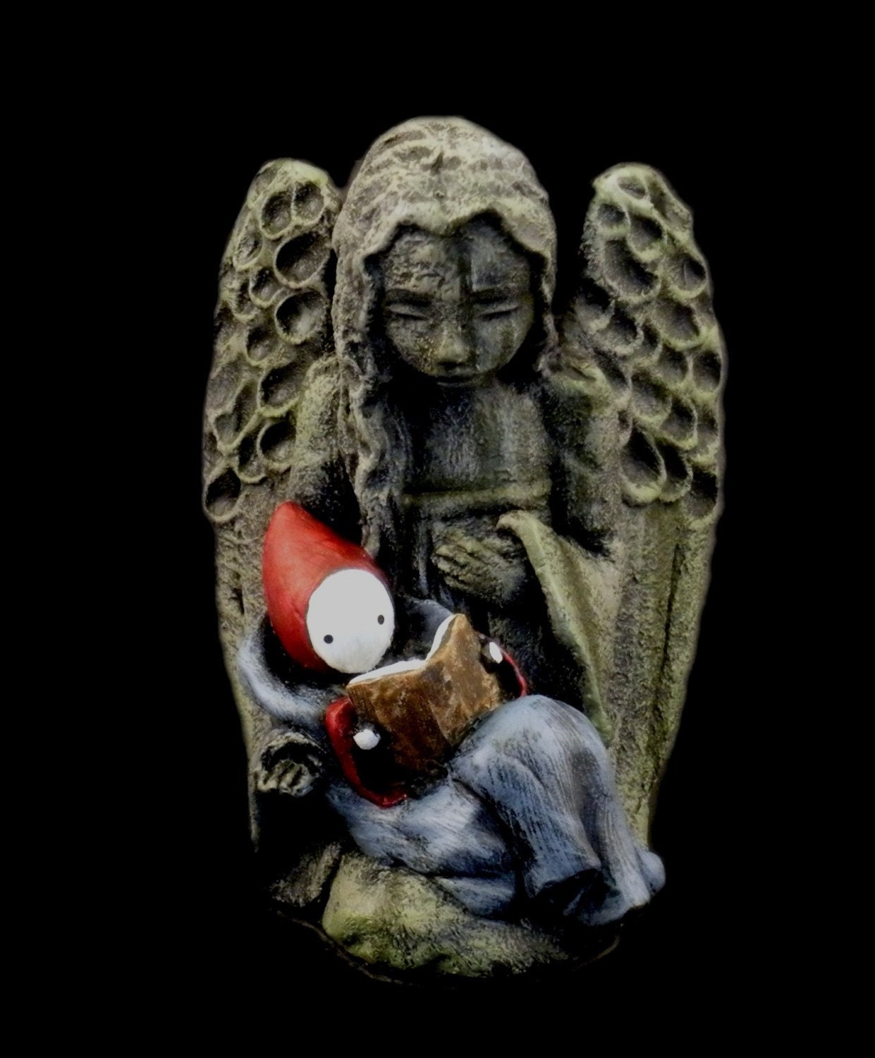 Graveyard Book Angel holds a reading Nobody Owens.