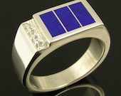 Sterling silver man's ring inlaid with lapis accented by white sapphires.