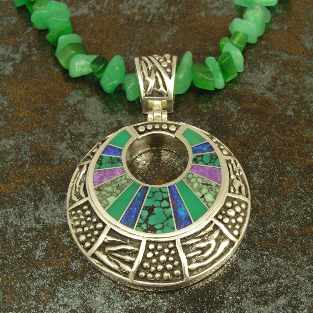 Sterling silver pendant inlaid with Australian opal, chrysoprase, spiderweb turquoise and sugilite by Mark Hileman.