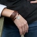 Five Time Red Brown Leather Wrap with Circular Floral Charm