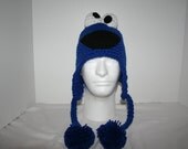 Adult size handmade crochet character hat with ear flaps and hanging pom poms  - fun and unique