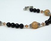 Dried Flower Petal Beads on Black Onyx Bracelet