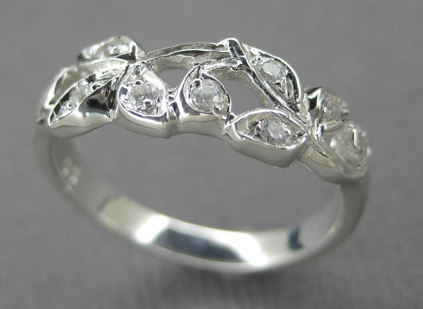 Engagement ring or anniversary ring.14k white gold leaf ring with diamonds.