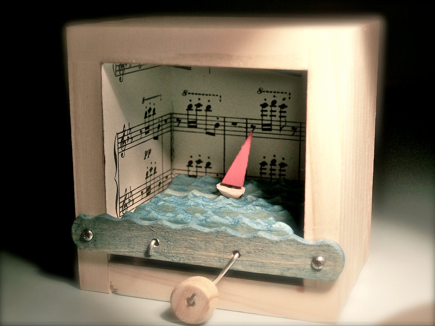 sailboat automaton in music note box