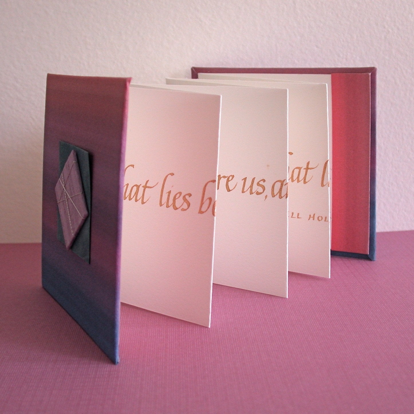 CALLIGRAPHY QUOTE BOOK - What lies behind us and what lies before us are tiny matters compared to what lies within us.