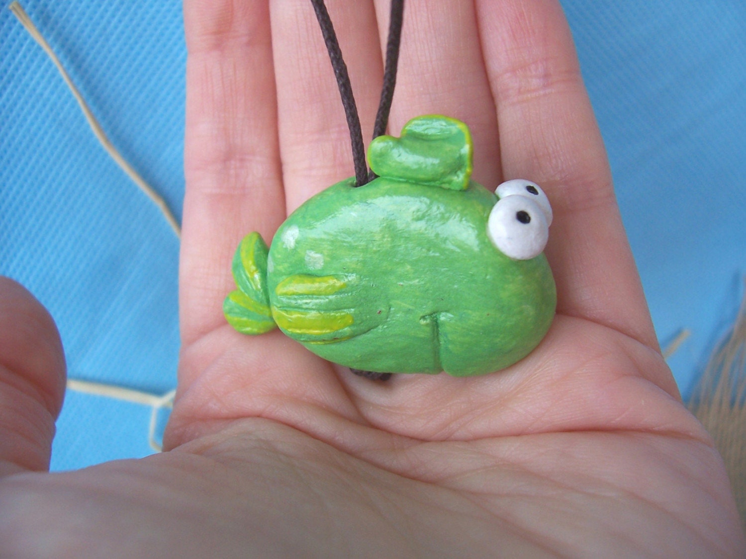 Funny smiling green fish - little hanging sculpture, home or office decoration