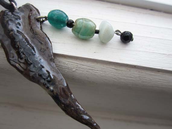 Emerald green pendant - drift wood black green glass beads
