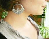Large silver earrings. Half moon antiqued silver hoops with oak leaf detail. Sterling silver earwires.