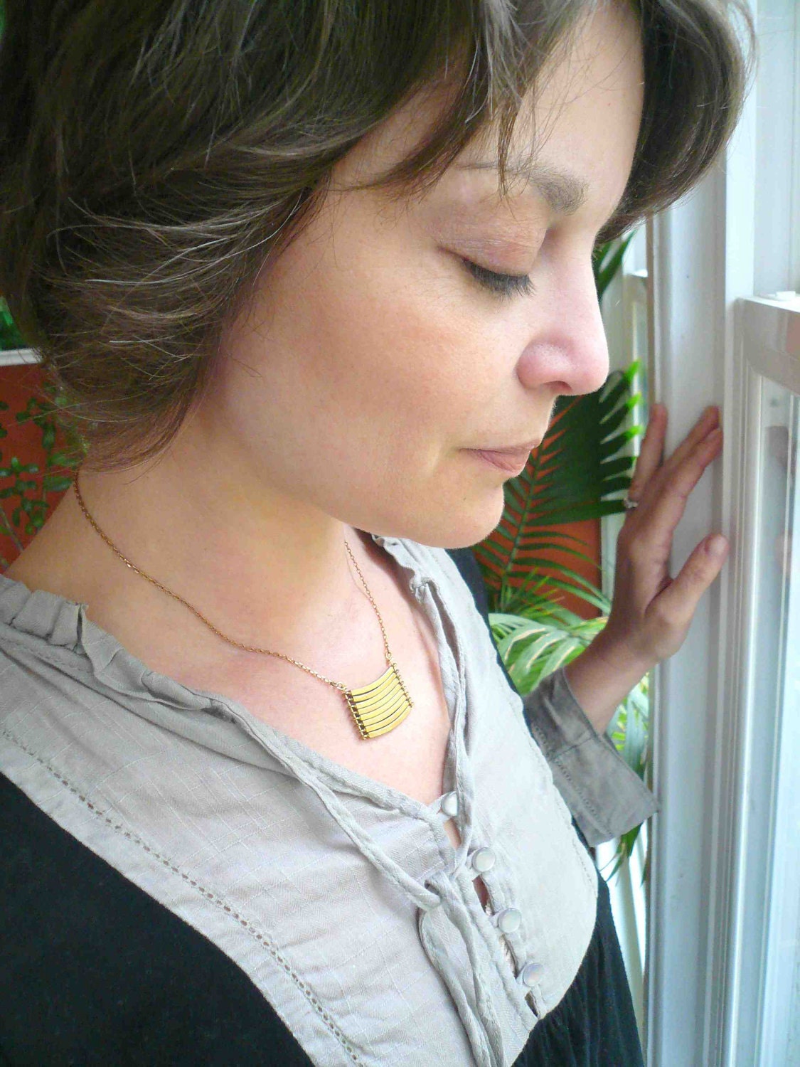 Brass geometric necklace with military style curved brass bars. Stacked bar necklace.