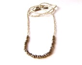 magnetic hill // necklace / bracelet with mini chunky geometric gunmetal beads on silver seed bead background