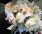 Bridal bouquet of cream white green pink taupe rosettes wrapped with tulle and silks