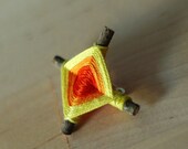 god's eye pin - yellow/orange/red orange