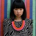 The Clemence woven rope necklace in orange and pink