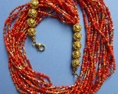 Sunburst orange, red, golden multi strand necklace