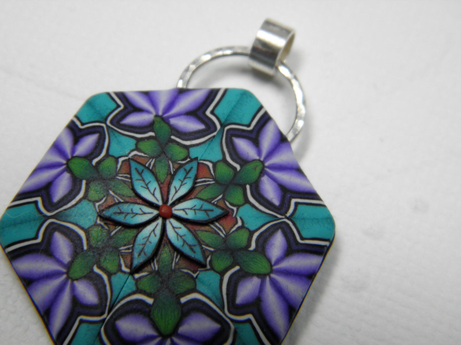 Pendant in a Floral Polymer Clay Kaleidoscope
