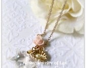 Ocean Gems Necklace made with a large star swarovski crystal, pink rose, sea shell charm, swarovski pearl etc.