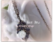 Rose Dew Necklace made with mother of pearl rose and leaf charm etc.