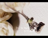Trip to Paris Necklace made with silver Eiffel Tower charm, silver bag charm, green rose, fresh water pearl etc.