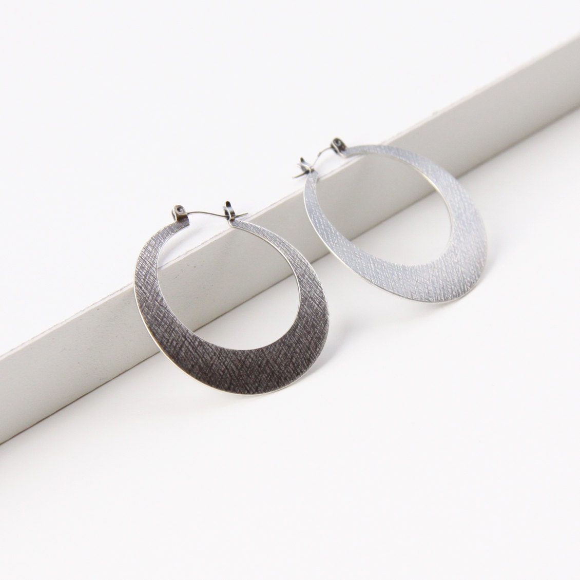 Modern silver hoop earrings, sleek design in crescent moon shape sturdy and lightweight design for everyday wear - "Silver Lunar Hoops"