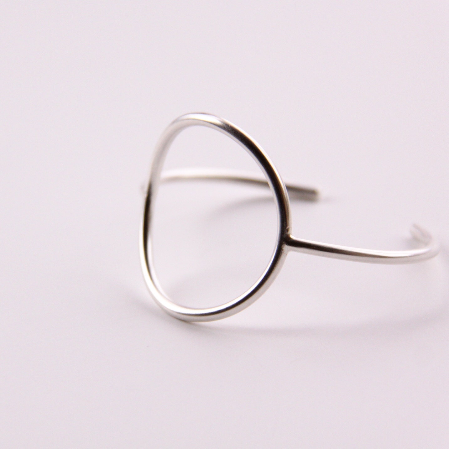 Minimalist silver bracelet of a focal circle shape forged, soldered and hand formed into comfortable, elegant wrist jewelry - "Centre Cuff"