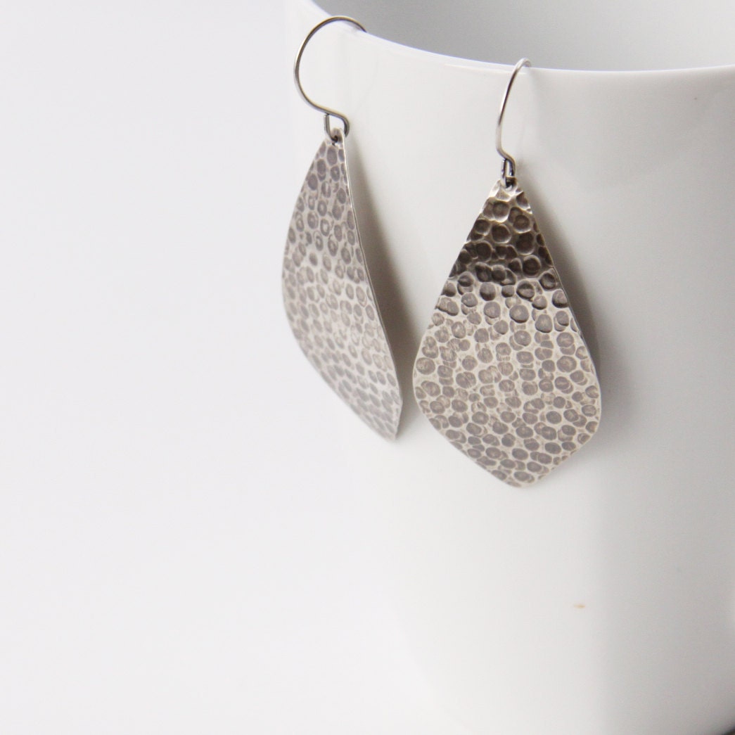 Handmade sterling silver earrings with a streamlined yet unique outer leaf shape and a distinctive hammered pattern - "La Hoja Earrings"