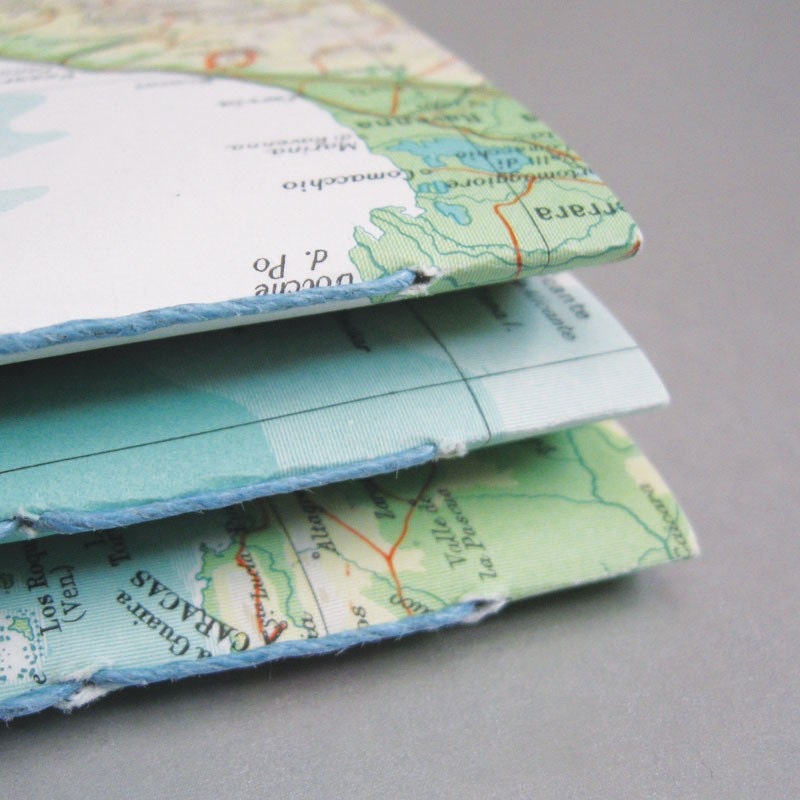 2 notebooks made with post-consumer, reused, rescued, and found papers