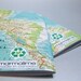 2 notebooks made with post-consumer, reused, rescued, and found papers