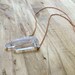 Triple quartz cluster on vintage brass chain
