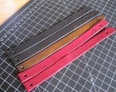 Leather Snap Bracelet with Lazy Leatherworker Logo - black, red, or brown.