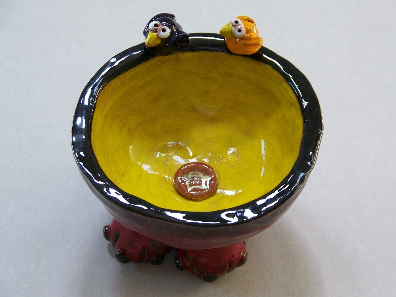 Red and Yellow Decorative Bowl with Orange and Dark Blue Birds