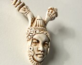 odd jester head faux ivory pendant