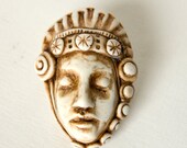 handmade faux ivory dreaming face pendant with scalloped crown