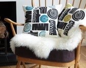 New colourway - Log pile cushion in charcoal on white linen