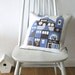 Siesta linen cushion in periwinkle blue and chocolate