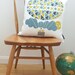 Ballooning cushion on white linen